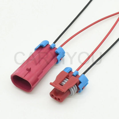 Demonstration of 2-pin male female connector fitting into automotive solenoid valve and EGR wiring harness