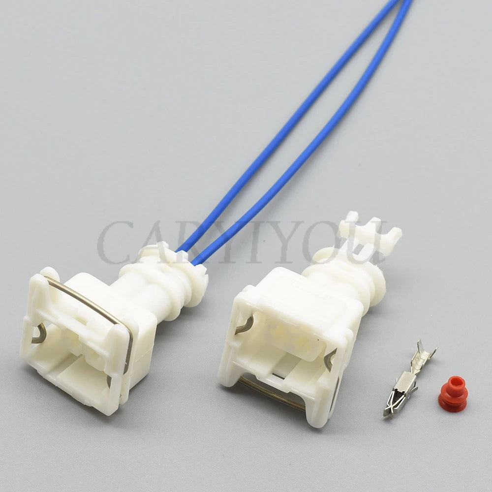 White 2-hole female automotive wire connector installed in car wiring harness for reliable performance