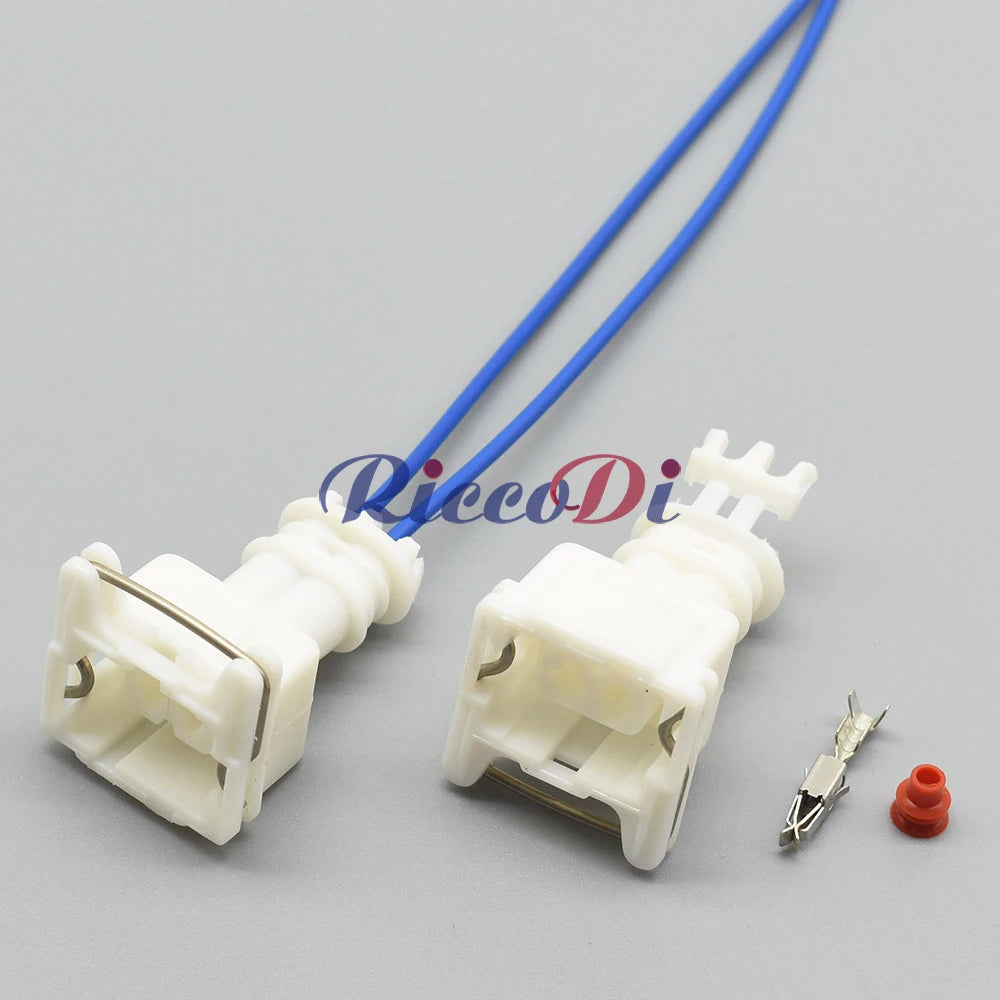 Close-up of 2-hole female automotive connector highlighting pins and wire attachment