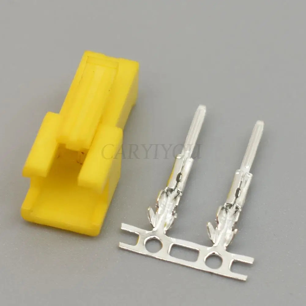 Close-up of 2 pin SM yellow connector plug with terminals for reliable electronic wiring